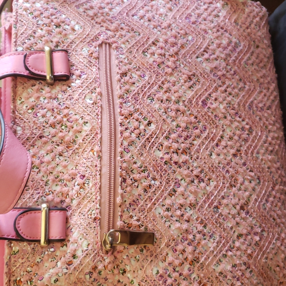 Pink woven fabric bag.